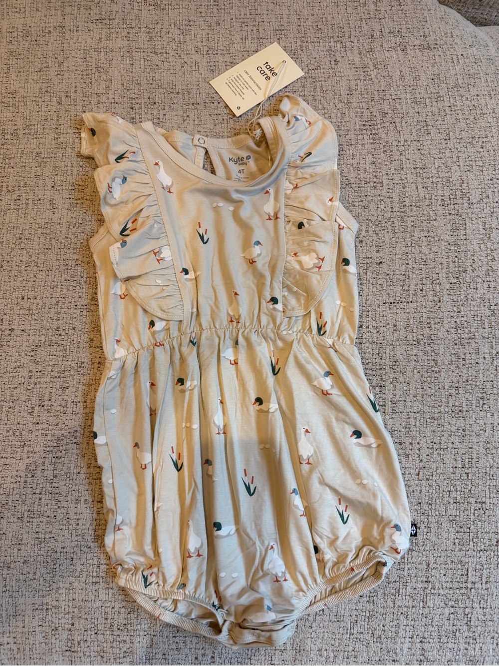 Kyte BABY Cream Duck Ruffle Bubble Romper